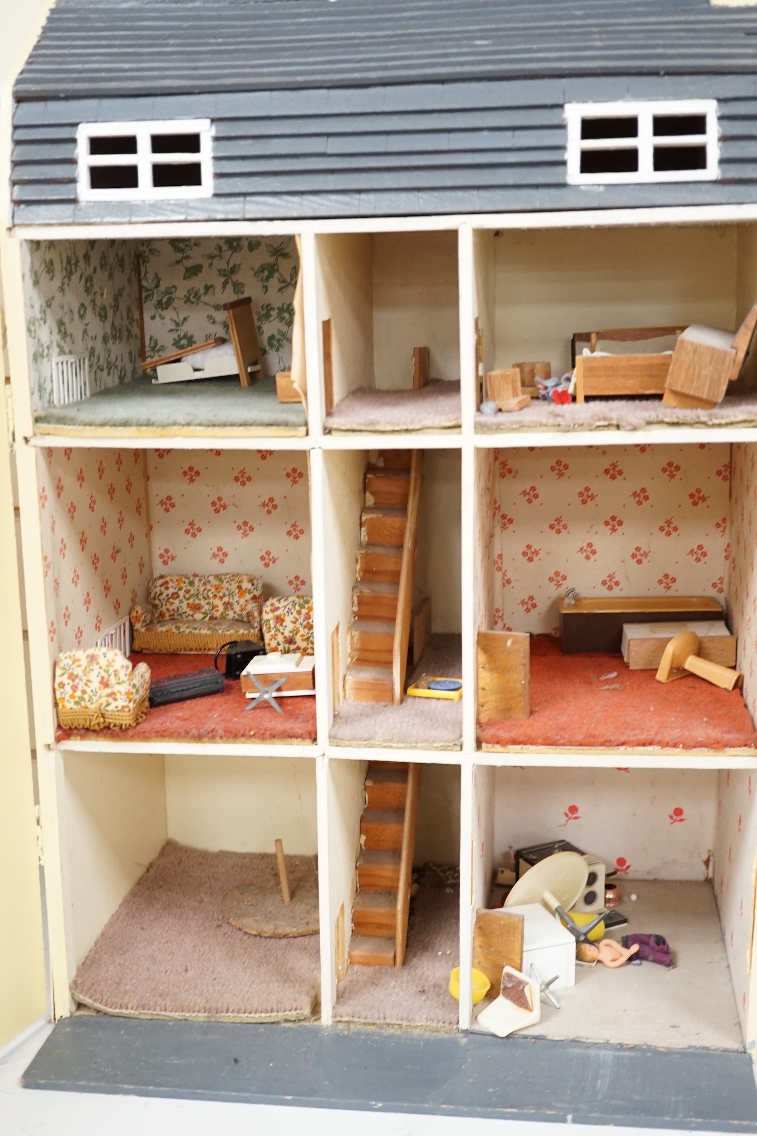 A doll's house based on a Georgian Bath townhouse, with contents, 43cm wide, 71cm high